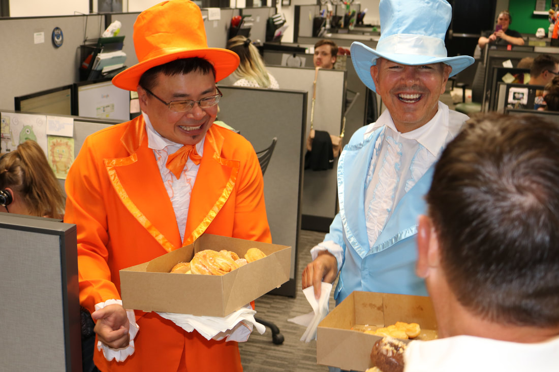 Great company culture starts at the top and works its way down. Owners Tommy Cheng and Devon Dickinson delivered donuts around the office for Treat Yo' Self Day 2018.